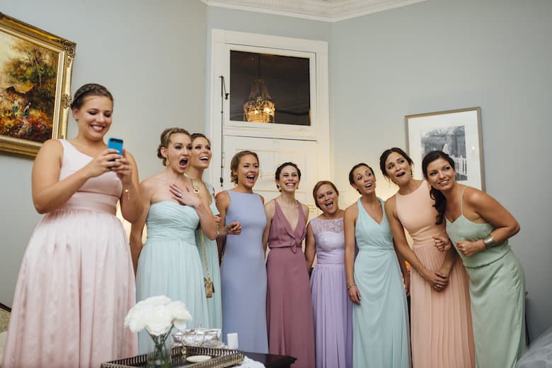 White wedding bridesmaids first look with bride mismatched dresses pastel colors