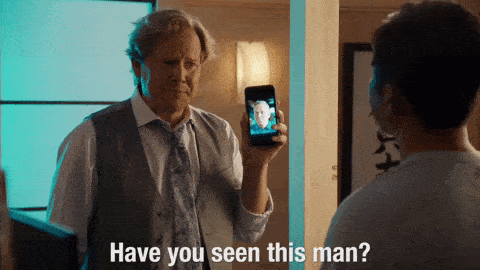 guy-holds-up-phone-with-picture-says-have-you-seen-this-man